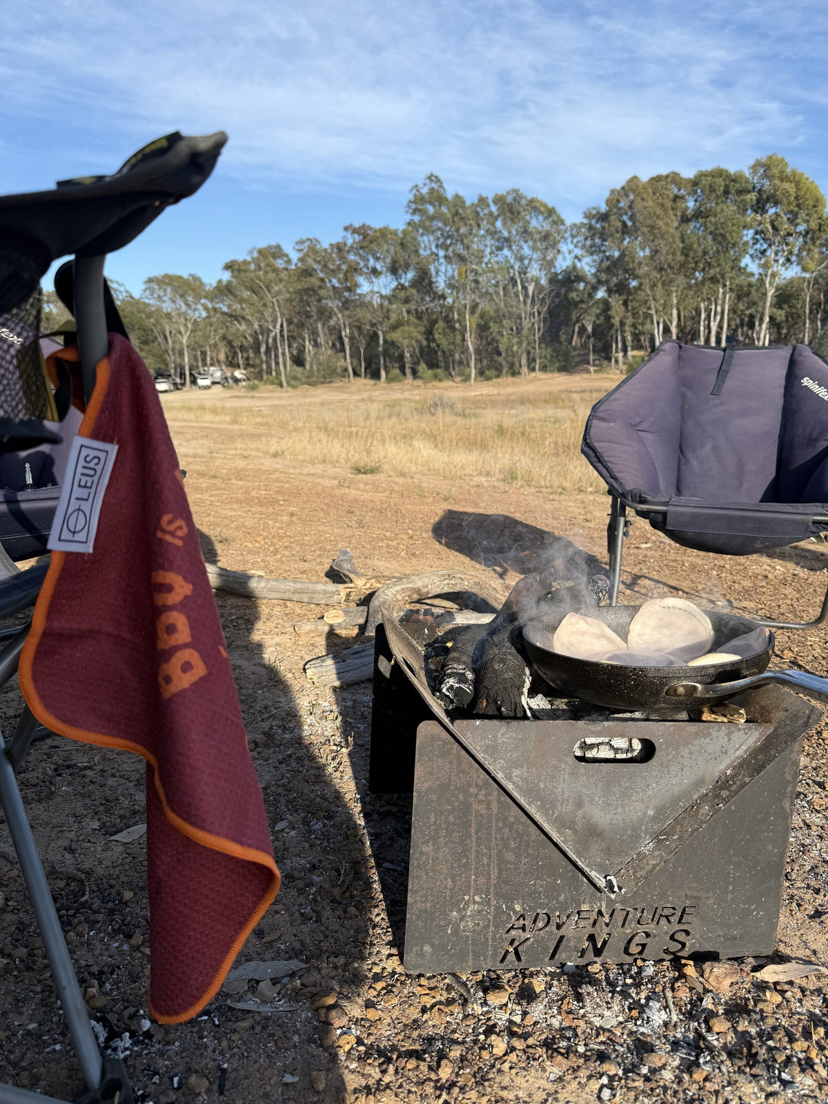 BBQ is Life BBQ Eco Towel: hanging on the camp chair by the fire pit - Leus Towels Australia