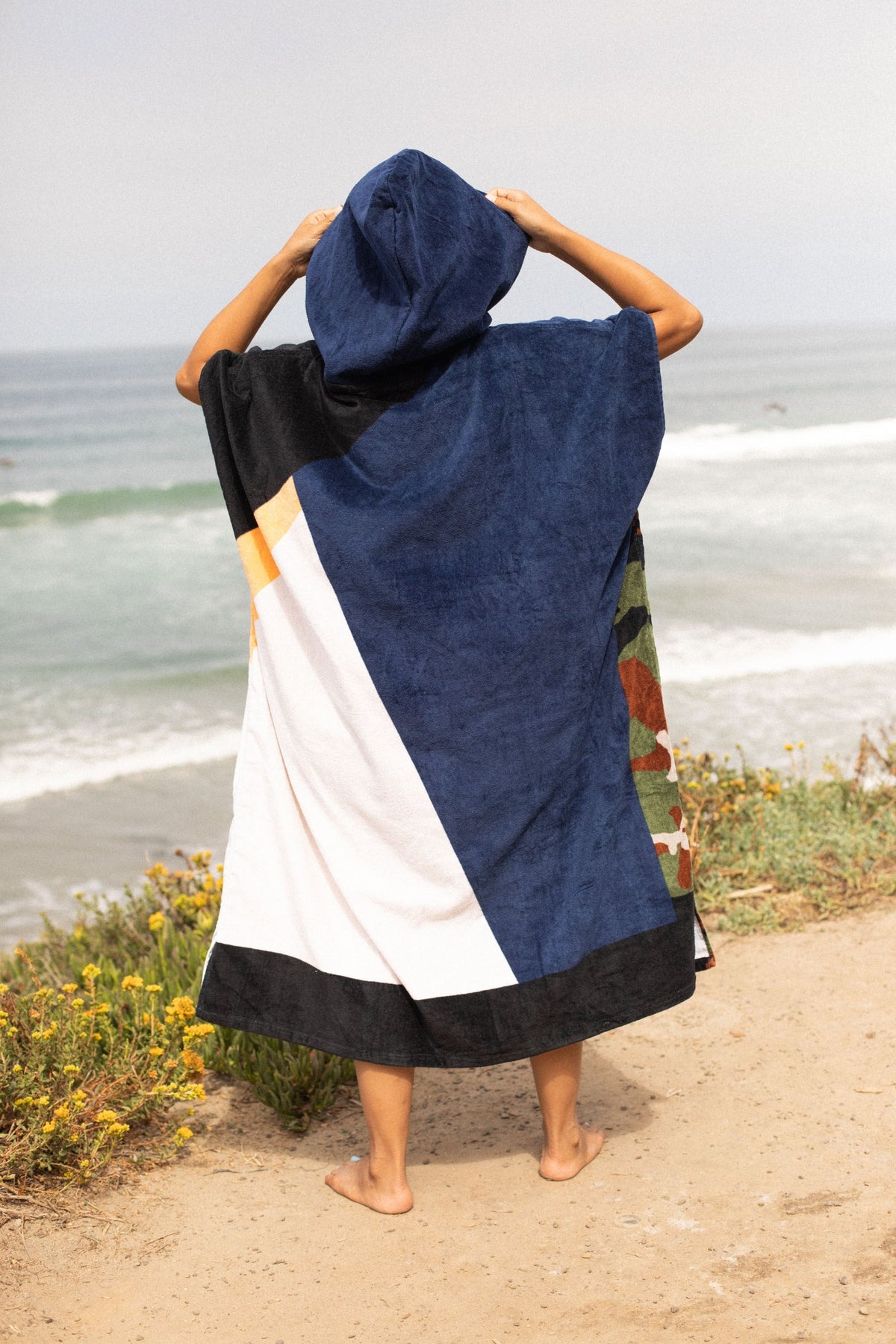 Sky Brown (Sunrise) Original Eco Poncho: back view, hood up, ocean - Leus Towels Australia