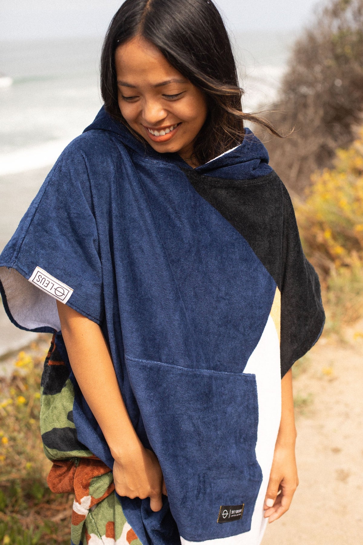 Sky Brown (Sunrise) Original Eco Poncho: front at the beach - Leus Towels Australia